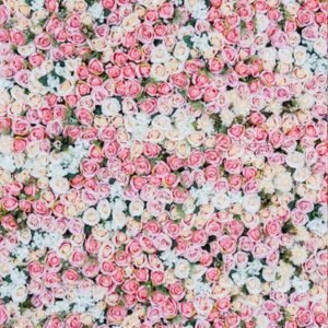 Beautiful pink, yellow, and white flower wall backdrop for events.