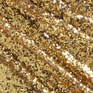 Sparkling gold sequin backdrop for events.