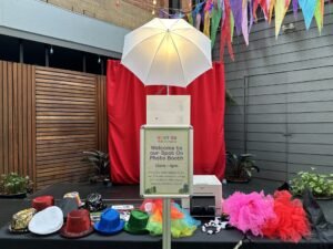 Contact details displayed for booking a photo booth.
