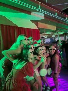 Guests posing in front of the Open Air Photo Booth.
