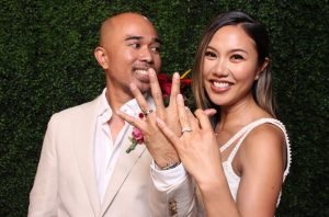 Couple posing in a stylish photo booth at a Sydney wedding